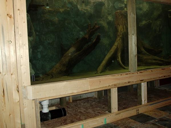 16.  This is a photo of the aquarium at capacity.  I calculated with the background and wood inside, I'm at about 900 gallons.  It heated up quite nicely and I was able to keep a constant 25 degrees with minimal humidity.